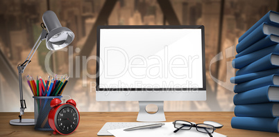 Composite image of image of a desk with computer
