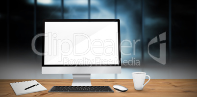 Composite image of image of a desk with computer