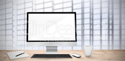 Composite image of image of a desk with computer