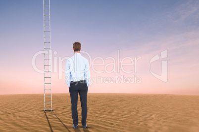 Composite image of rear view of businessman with hands in pocket