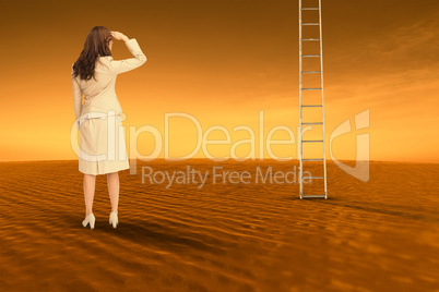 Composite image of rear view of young businesswoman looking away