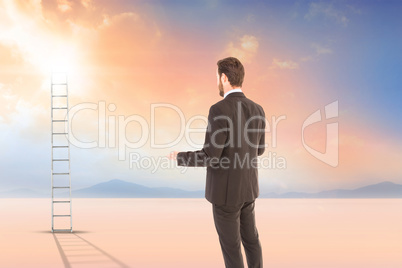 Composite image of rear view of businessman standing