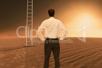 Composite image of rear view of classy young businessman posing