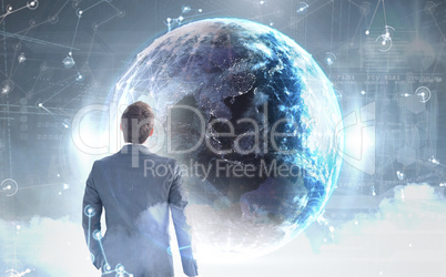 Composite image of businessman standing with his briefcase
