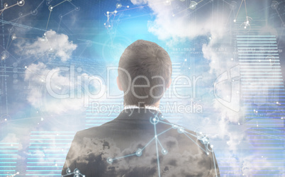 Composite image of businessman looking up in suit