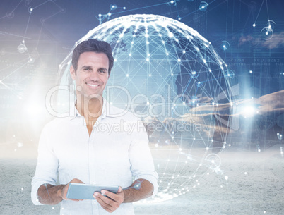 Composite image of portrait of smiling man using digital tablet