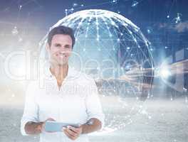 Composite image of portrait of smiling man using digital tablet
