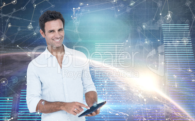 Composite image of portrait of smiling man using tablet computer