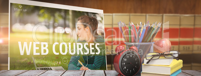 Composite image of school supplies on desk