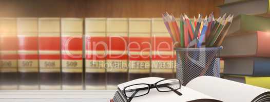 Composite image of school supplies on desk