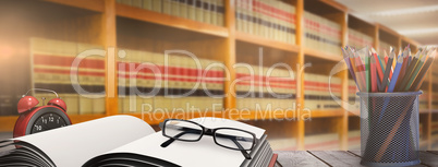 Composite image of school supplies on desk