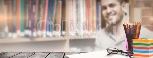 Composite image of school supplies on desk