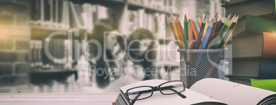 Composite image of school supplies on desk