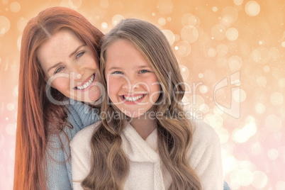 Composite image of portrait of happy mother with daughter