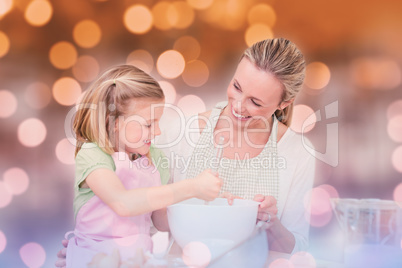 Composite image of mother and daughter having fun in the kitchen