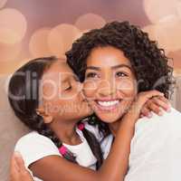 Portrait of a mother and daughter holding each other