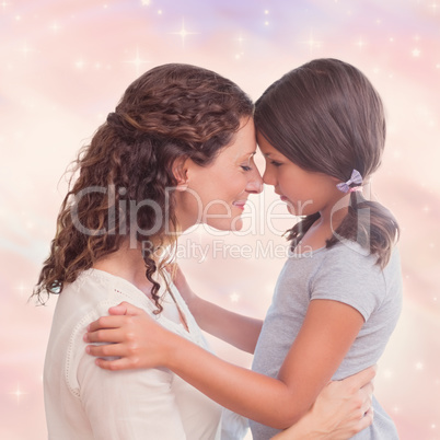 Portrait of mother and daughter holding each other