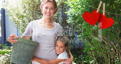 Composite image of Mother and daughter holding each other