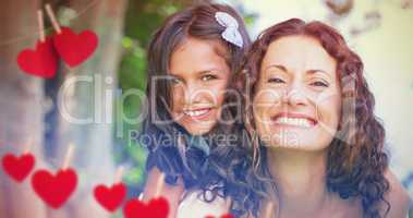 Composite image of  mother and daughter smiling