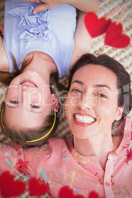 Composite image of hearts hanging on a line