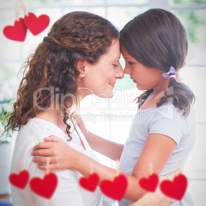 Composite image of hearts hanging on a line