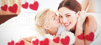 Composite image of cute little girl kissing her mother