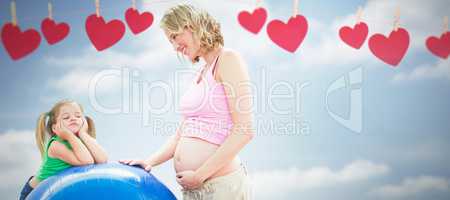 Composite image of smiling pregnant woman with young daughter