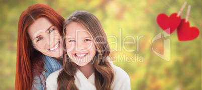 Composite image of portrait of happy mother with daughter