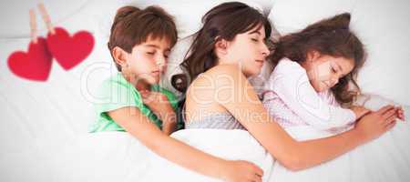 Composite image of mother and her daughter having fun on bed