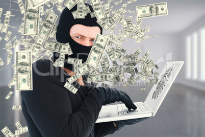 Composite image of hacker using laptop to steal identity