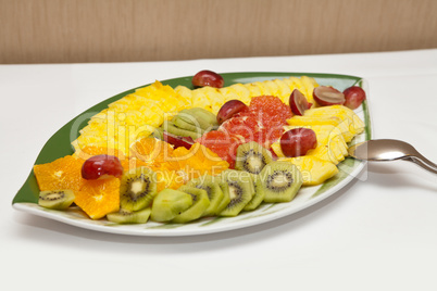 Variety of sliced fruit served on a platter