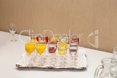 Red and yellow juice in tall glasses