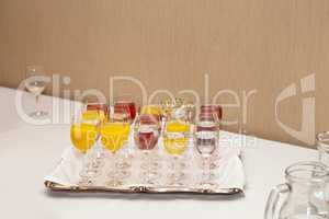 Red and yellow juice in tall glasses