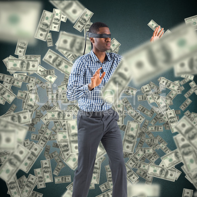 Composite image of blindfolded businessman with arms out