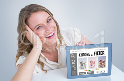 Composite image of woman showing tablet pc