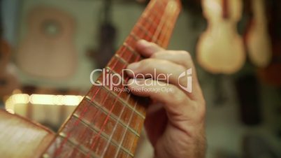 12-Old Man Lute Maker Playing Classic Guitar In Shop