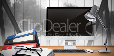 Composite image of image of a desk with computer