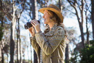 Woman using binoculars