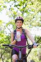 Smiling woman cycling