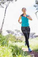 Smiling woman jogging