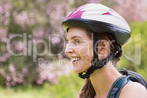 Smiling woman wearing a helmet