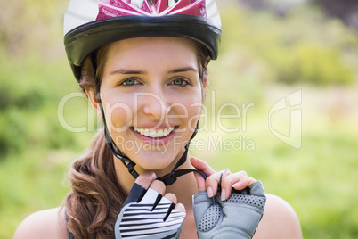 Smiling woman wearing a helmet