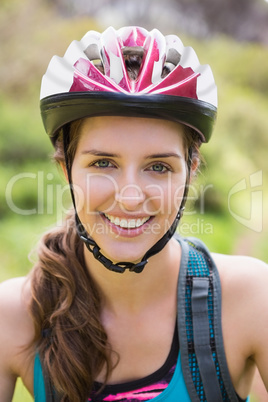 Smiling woman wearing a helmet