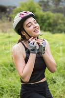 Woman touching her helmet