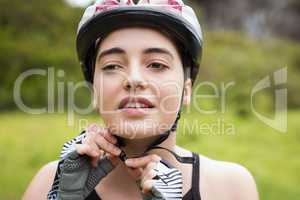 Woman touching her helmet