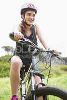 Smiling woman cycling