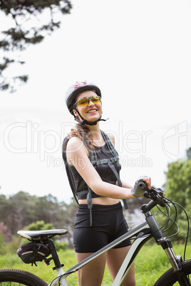 Woman standing next to her bike