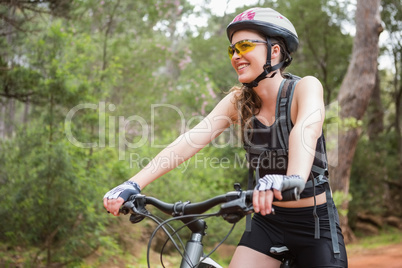 Smiling woman cycling