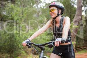 Smiling woman cycling