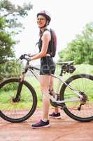 Woman standing with her bike